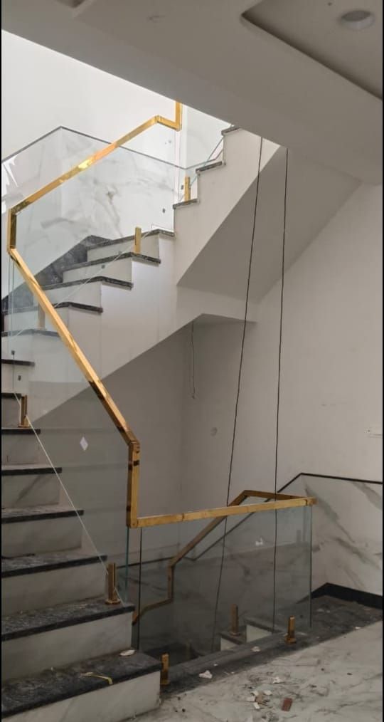 Glass balustrade with metal handrail